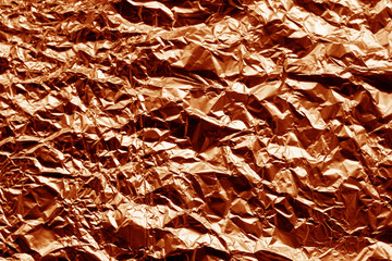 Metal foil texture in orange color.