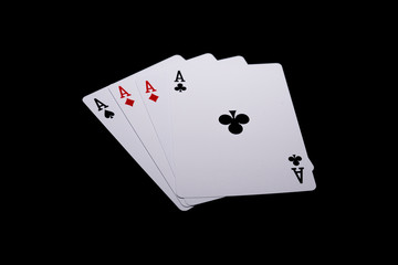 Four aces playing cards poker winner hand on a black background