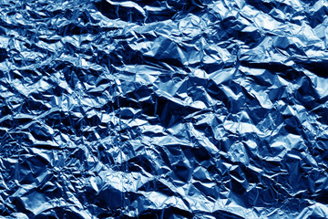 Metal foil texture in navy blue color.