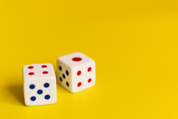 white dice on yellow background