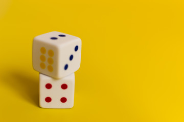 white dice on yellow background
