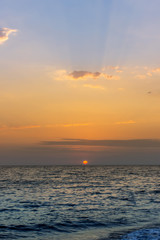 Sunset on the sea. Vertical view.