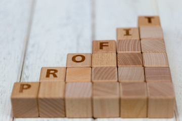 Wooden blocks on white wooden background. Business concept.