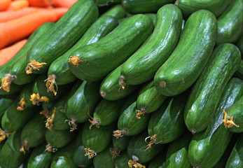 green cucumber in a stall