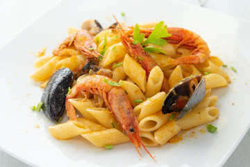 Penne allo scoglio e bottarga, dish of italian pasta with seafoods and bottarga