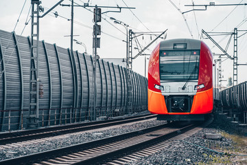 Modern high-speed train moves fast along the platform