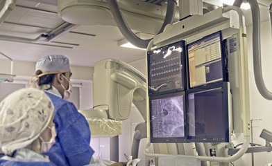 The doctor performs coronary stenting in a patient with a myocardial infarction      