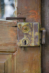 Old rusty lock on the door