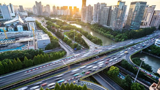 timelapse of  busy traffic road with city skyline in hangzhou china