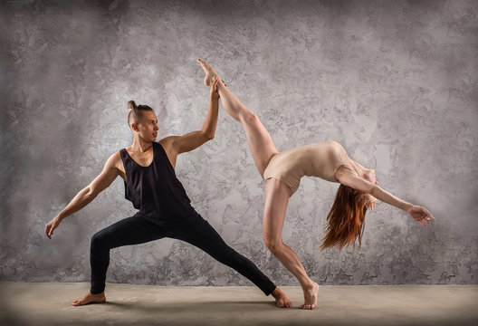 Two person, dancers, woman and man in dynamic action figure pose 