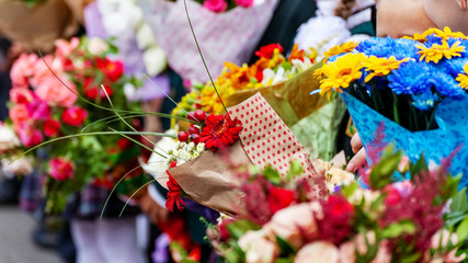 Bouquets of flowers in hands of children