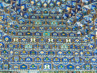 Geometric decoration of Islamic architecture. Detail of mosaic of ceramic tiles in Registan Square. Samarkand, Uzbekistan