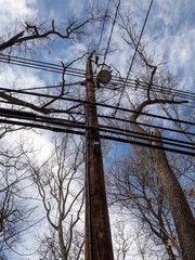 electric pole with transformer and electric and fiber cables