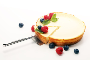 Homemade cheesecake with fresh raspberries and mint for dessert - healthy organic summer dessert...