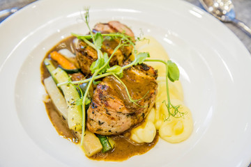 Pork tenderloin with mashed potatoes and steamed vegetables