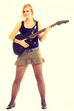 Woman artist player with electric guitar.
