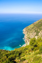 Fototapeta na wymiar Rocks in the blue Mediterranean Sea on a bright sunny day.