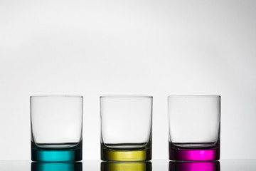 Multicolored empty glasses.