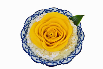 Coconut sticky rice with mango cut rose shape in Thai style bowl on white background..Thai desert summer menu. © posinote