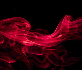 Red smoke on black background