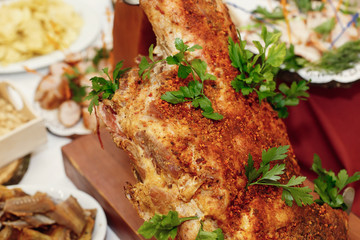 salty smoked ham on wooden desk on table, wedding reception. beer bar and snacks. catering in restaurant