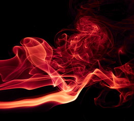 Red smoke on black background