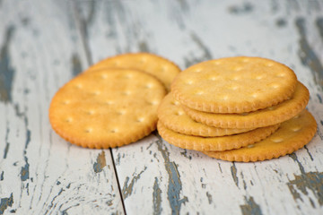 A few dry cracker cookies on a old wooden board