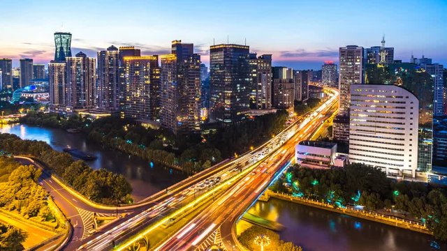 timelapse of  busy traffic road with city skyline in hangzhou china