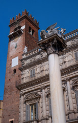 Verona, Italy - 06 May 2018: Verona historic city center - Palazzo Maffei palace and the Venecian Lion statue on the Piazza Erbe Square