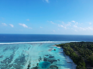 Drone aerial view set of a paradise island resort in maldives.