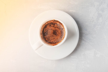 Coffee cup and saucer on a white background.
