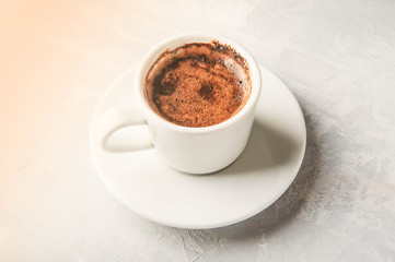Coffee cup and saucer on a white background.