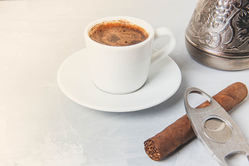 Cup and Turk coffee, cigar and guillotine isolated on white background.