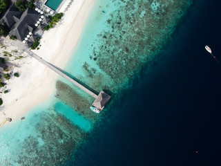 Drone aerial view set of a paradise island resort in maldives.