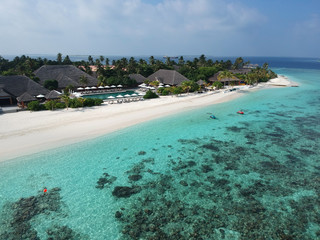 Drone aerial view set of a paradise island resort in maldives.
