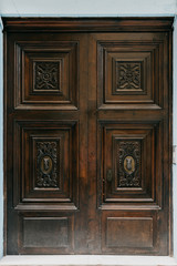 A beautiful old self-made wooden door in Spain. Chocolate color 