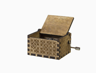 Front view of music box on white background. Macro of the music box with intricate patterns and...