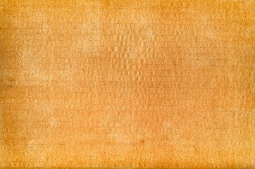 Orange cardboard texture background, close up.