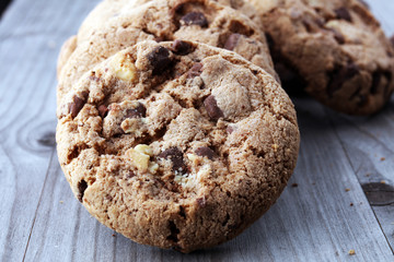 Chocolate cookies on wooden table. Chocolate chip cookies shot.