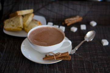 Cup of Cocoa, Cinnamon Sticks and Sugar Cubes