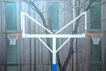 A basketball goalpost that stands up in both directions.