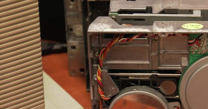 Floppy Disk Drive. Computer or game console from the 90s. Old retro style. , Panning, closeup. 