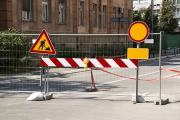 Signs that mark works on the road and forbidden passage