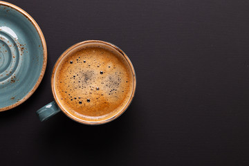 Cup of coffee on black background. Copy space. Top view. Flat lay. - 219042701