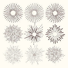 Set and collection of trendy hand drawn retro sunburst/bursting rays design elements.