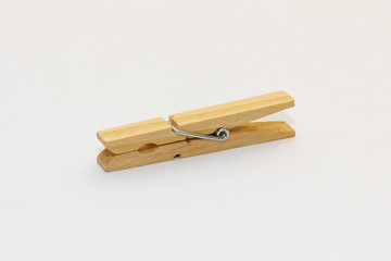 Isolated wooden clothes peg on a white background