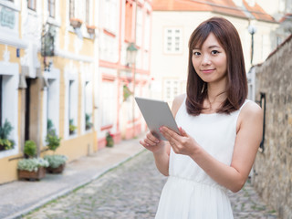 attractive asian woman traveling in europe