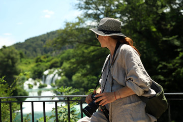Tourist woman in Croatia, waterfall Krka national park Croatia women photorapher