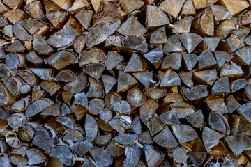 Detail of old and dark firewood stack