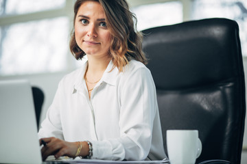 Young woman in office working